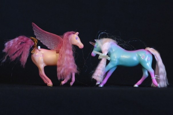 Mira & Ivy; <h2>Mira</h2> Body Color: Peach and Pink<br/>Hair Color: Coral Pink<br/>Breed: Pegasus Pink Wings <br/>Symbol: 3 Pink bow ties <br/>Brush: Pink<br/> Accessories: 2 Gold Ribbons <br/>Notes: <h2>Ivy</h2>  Body Color: Teal and Pink <br/>Hair Color: Light Pink <br/>Breed: Unicorn Pink Horn<br/>Symbol: 3 Pink Leaves (They look more like spades)<br/> Accessories: 2 Teal Ribbons<br/>Notes: Tail Braided. <br />Trading Card Story: Mira loves to make herself look pretty by adding bows and ribbons to her long hair. Her good friend Ivy loves to help by winding flowered vines through Mira's mane. The sparkle of Ivy's horn makes flowers blossom wherever she goes.
